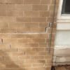 Patching The Brick Wall Cracks With Motar