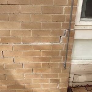 Patching The Brick Wall Cracks With Motar - Image 3