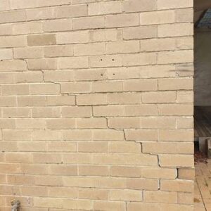 Patching The Brick Wall Cracks With Motar - Image 1