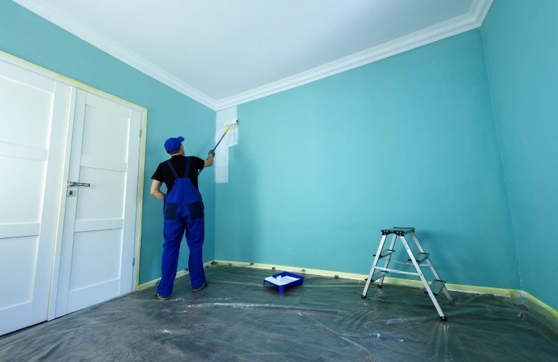 Professional painters preparing a West Melbourne property for repainting